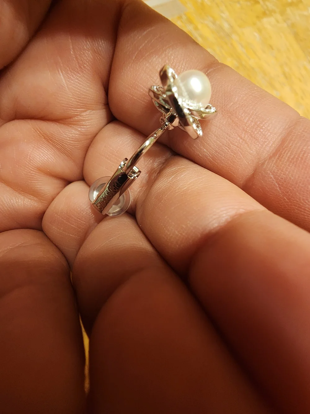 classic Swarovski Crystal Pearl clip ons featuring a central cream faux pearl